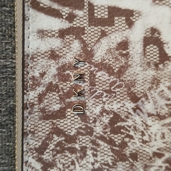 Brand new DKNY medium wristlet. Brown Graffiti pattern. Retails $78 - Picture 7 of 9